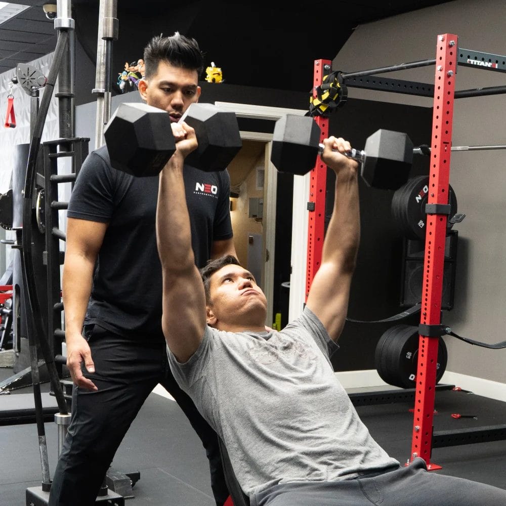 Man training overhead triceps
